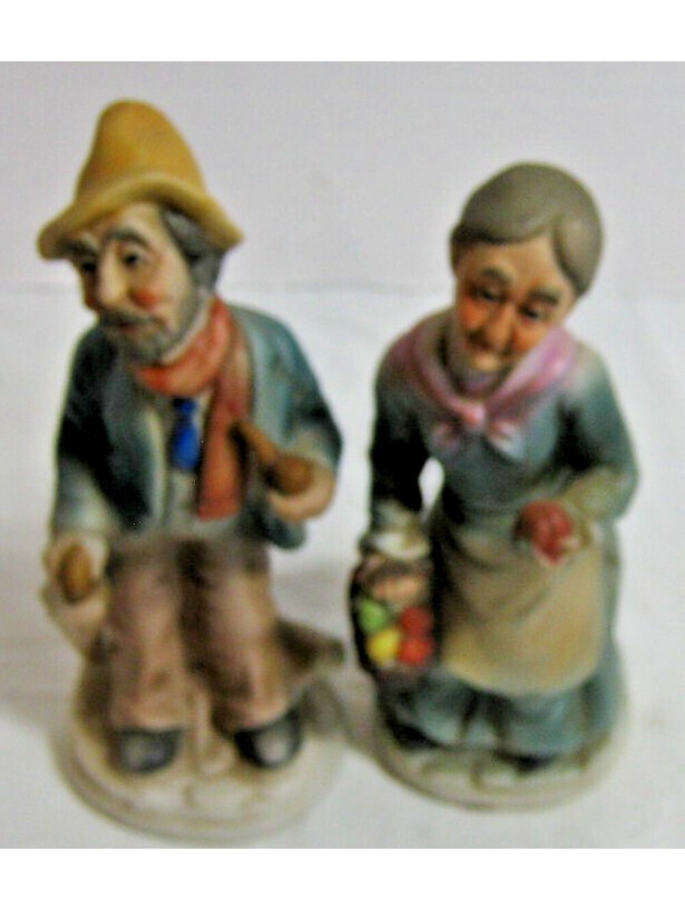 Elderly Farm Couple Holding Baskets of Produce